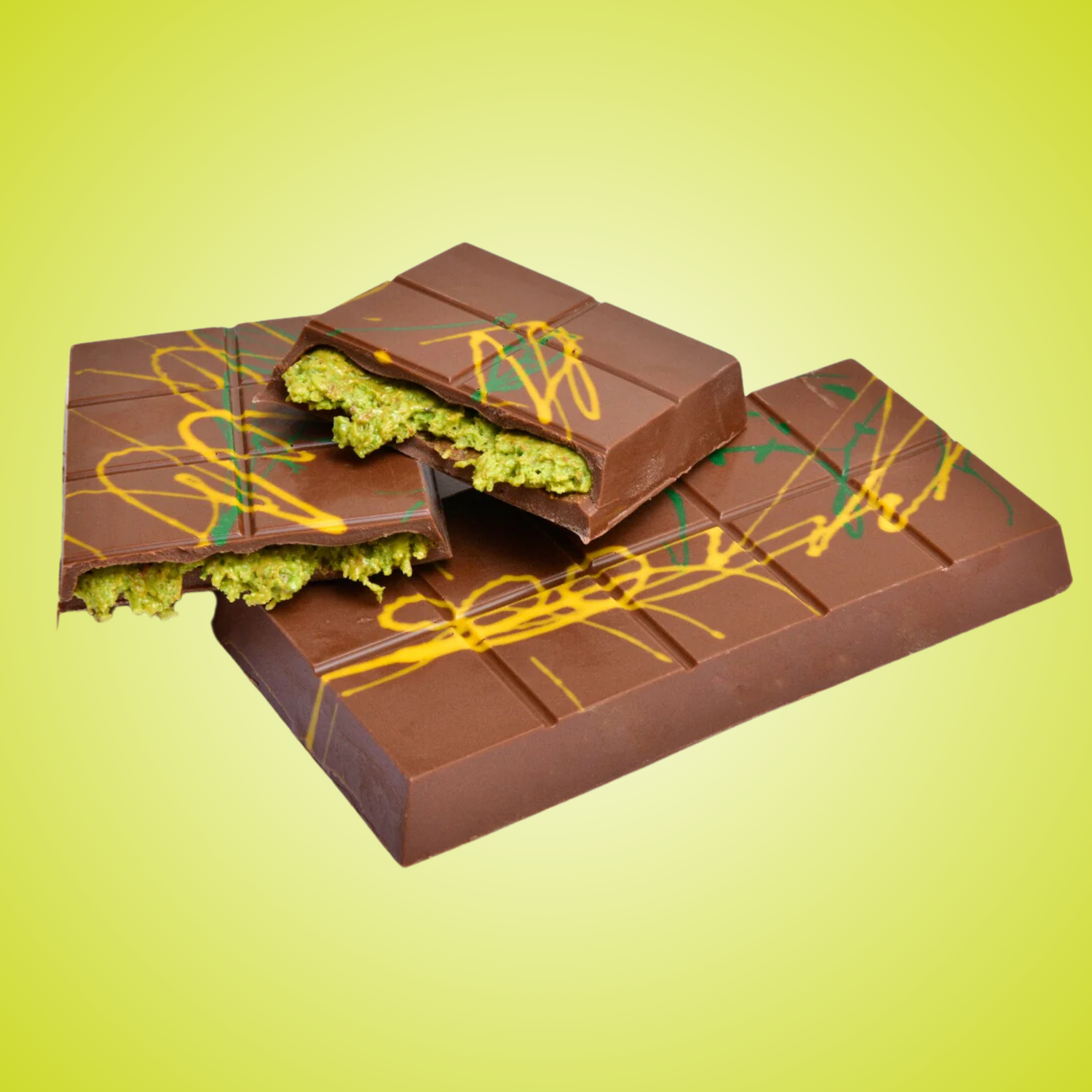 Three boxes of Alyan Dubai Handmade Chocolate on a dark wooden surface, with packaging in shades of brown, green, and blue, each featuring an image of chocolate pieces and the Dubai skyline in the background.